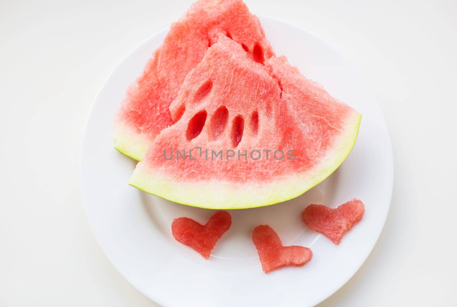 watermelon on a white plate by sfinks