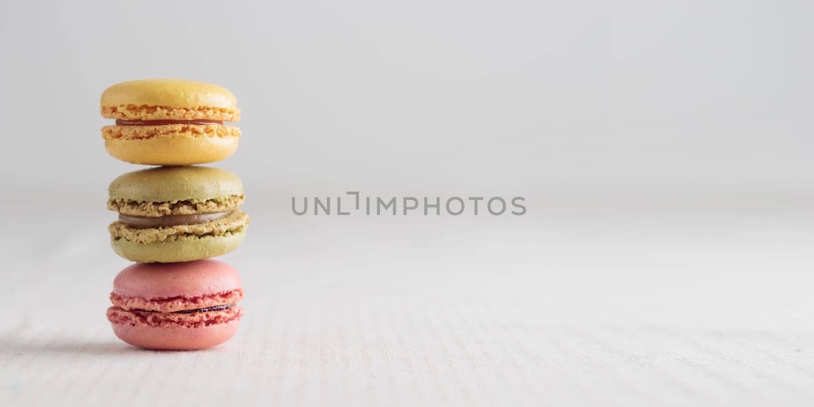 Colorful pastel eco handmade natural macaroons on white background. Gift for 8 March, International Women's Day, Valentine Day. Horizontal banner closeup with a copyspace