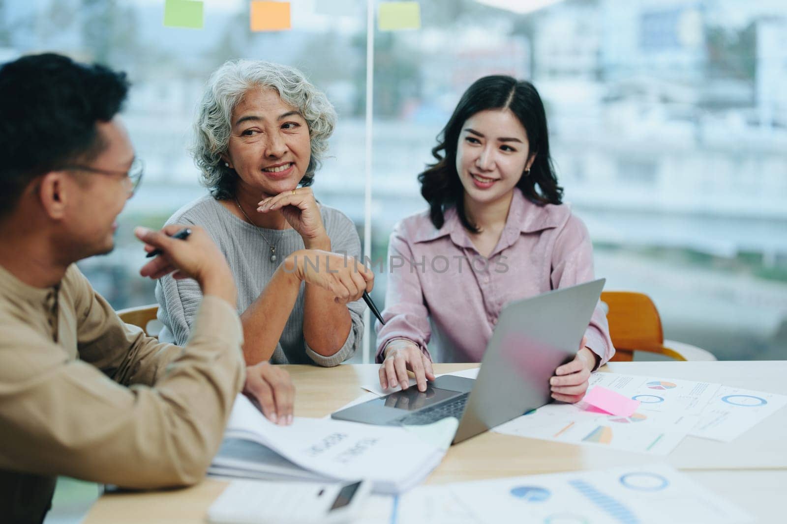 Asian entrepreneurs and business people meeting in a conference room in business planning, financial budget and investment risk assessment to analyze customer groups to increase company growth.