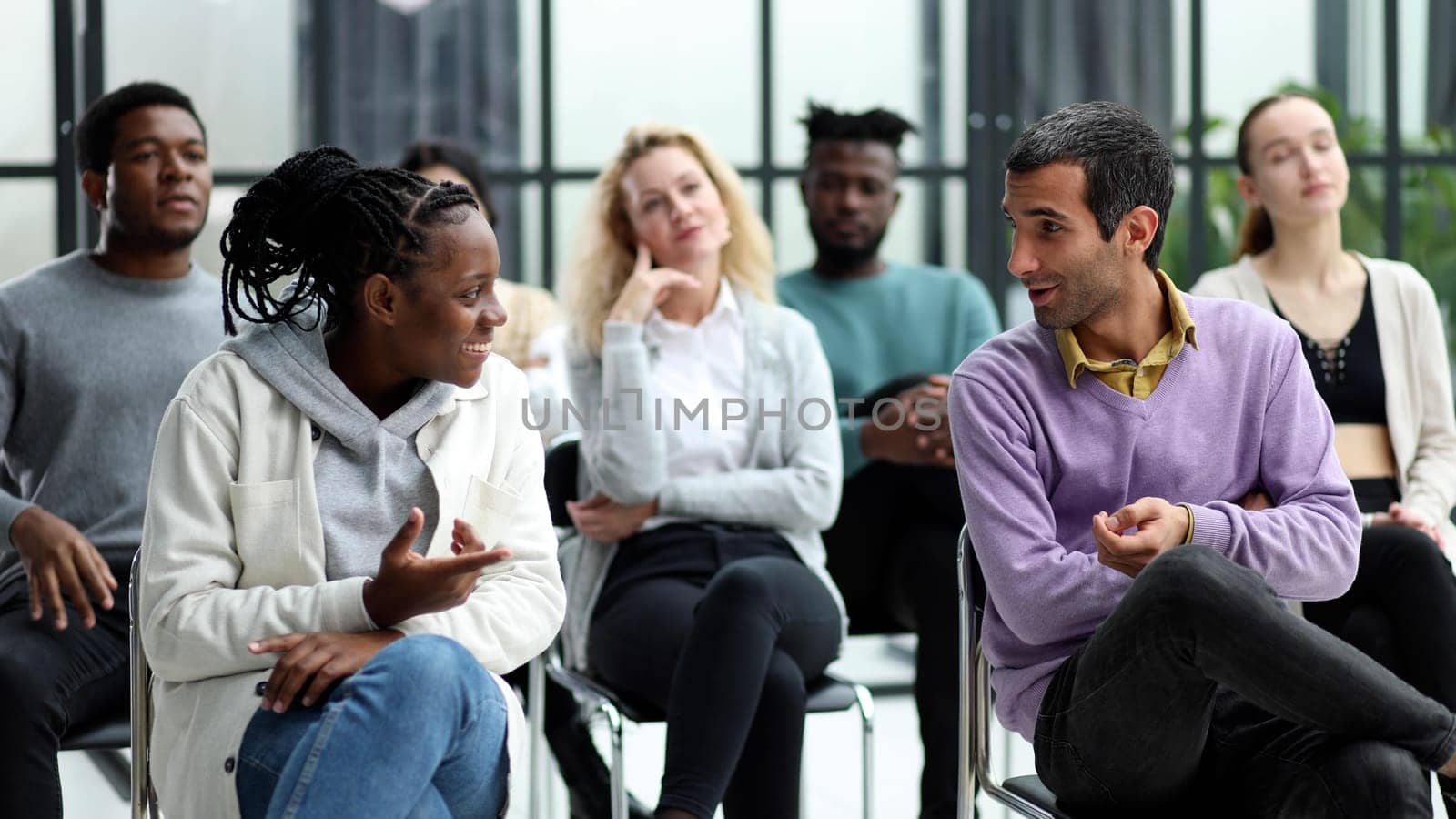 close up. smiling guy shaking hands with his friend