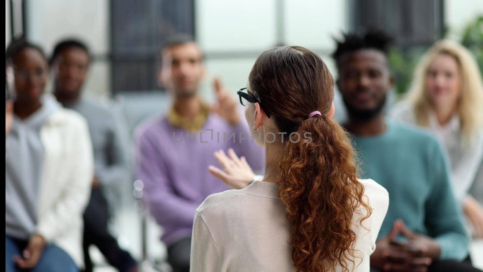 young business woman giving a presentation in a conference room. Back view