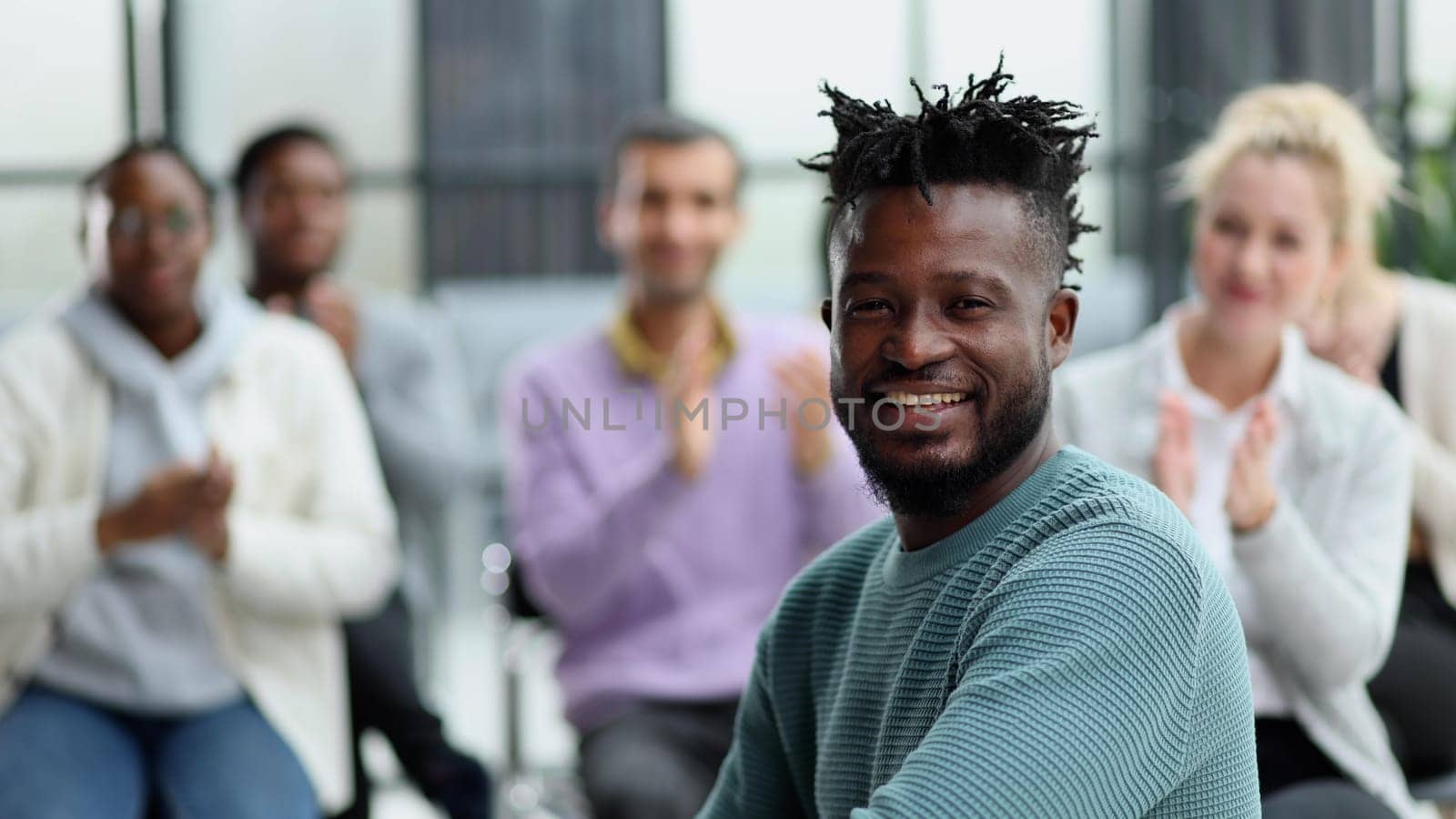 Several ethnic groups share ideas while sitting in an office by Prosto