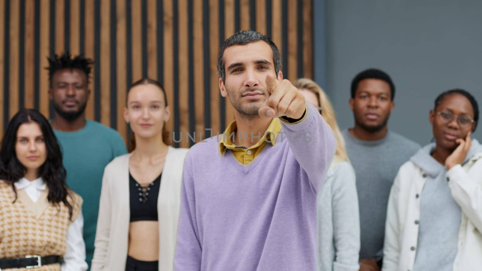 Young businessman points his index finger at the camera. Call to Action Motivation Concept