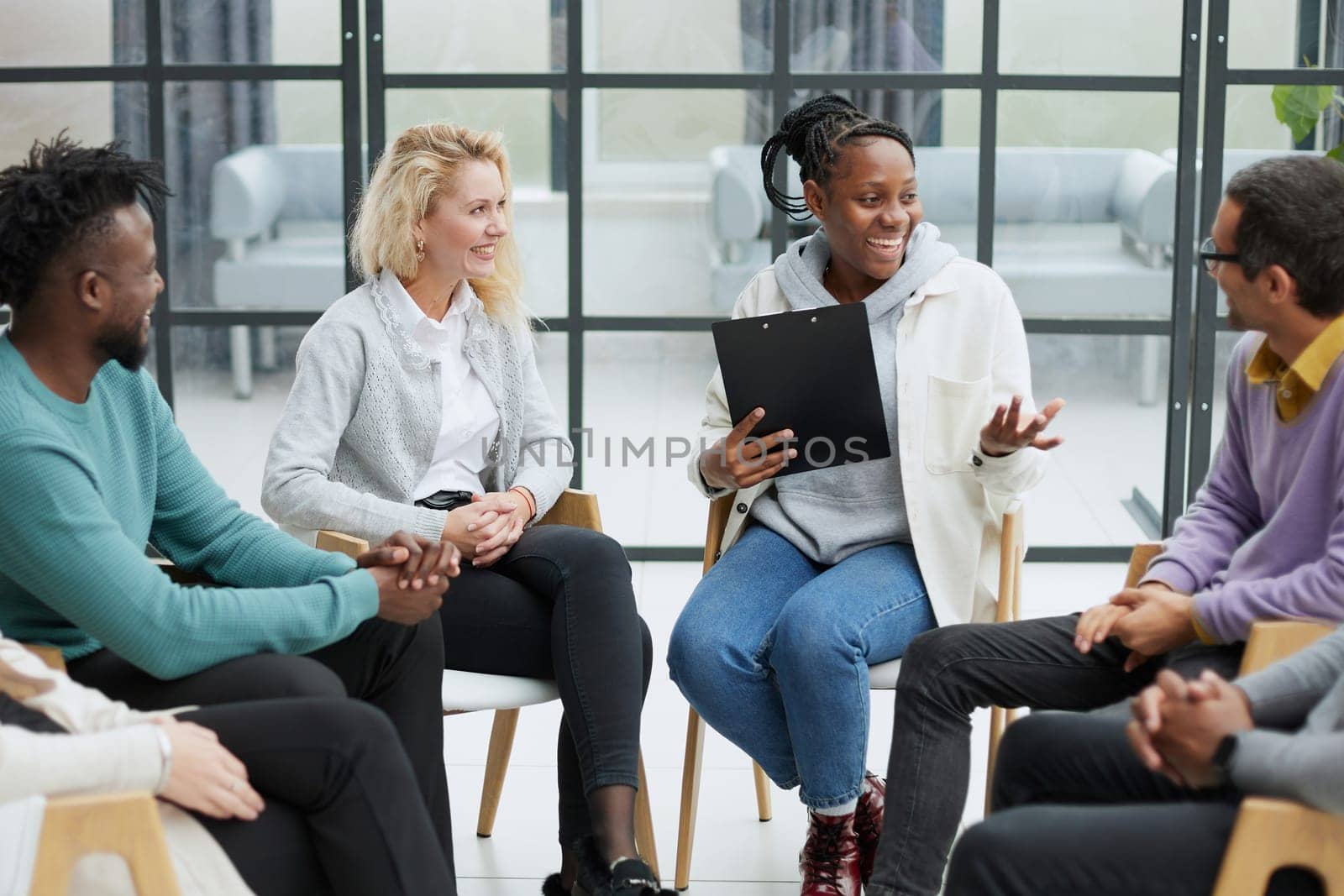 conducts business training with a group of young people.
