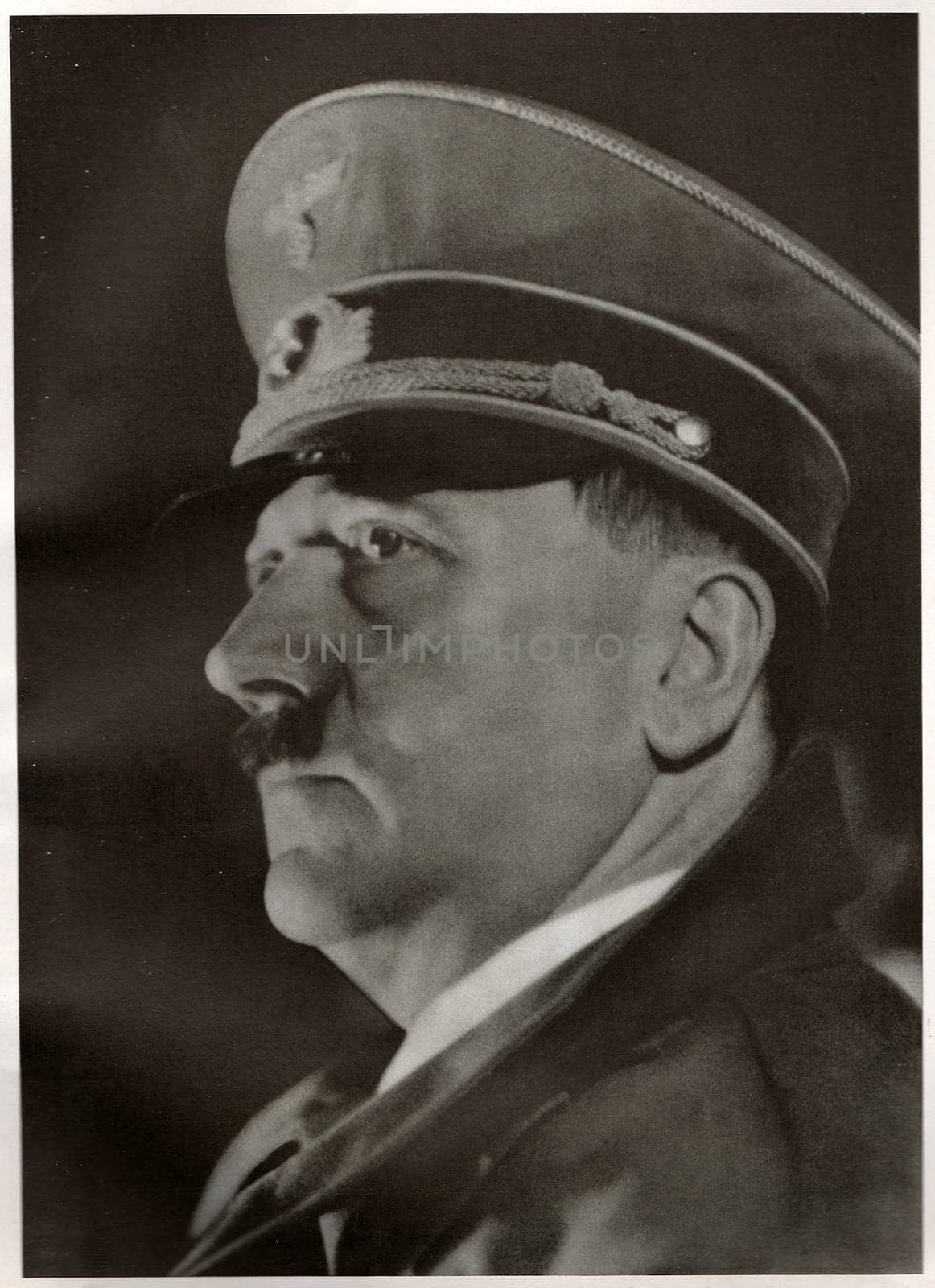 LINZ, AUSTRIA - MARCH 12, 1938: Hitler declares Germany and Austria (Ostmark) united as one entity, the beginning of the GroÃ deutsches Reich (Greater German Empire). Emotional speech from the balcony of the Linz town hall. Reproduction of antique photo.