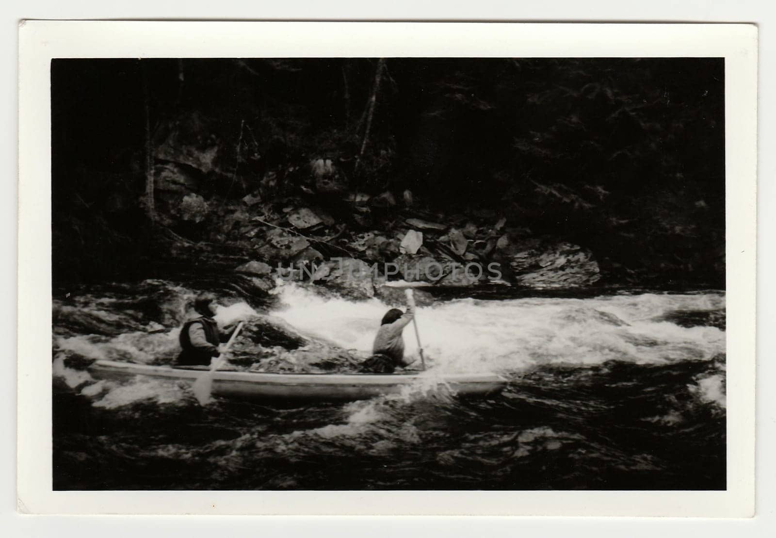 THE CZECHOSLOVAK SOCIALIST REPUBLIC - CIRCA 1980s: Vintage photo shows young canoeists on the river.