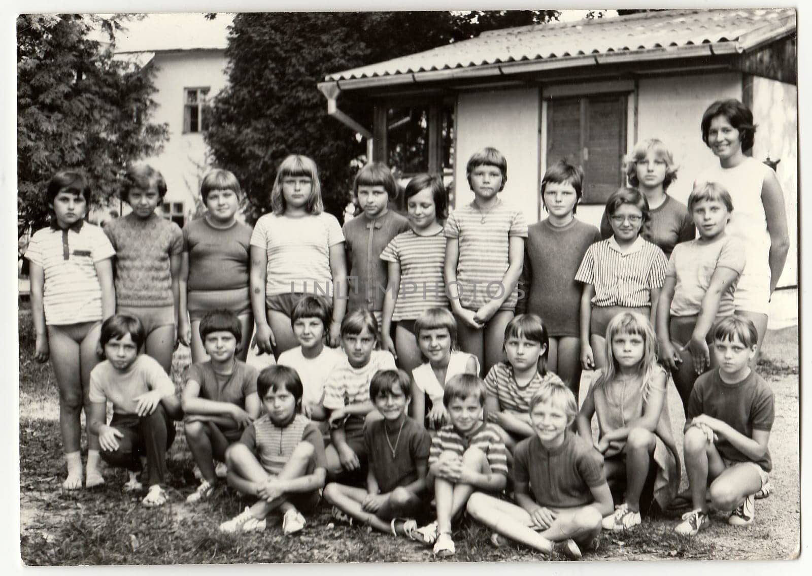 Vintage photo shows teenagers and female chiefs at summer camp. by roman_nerud