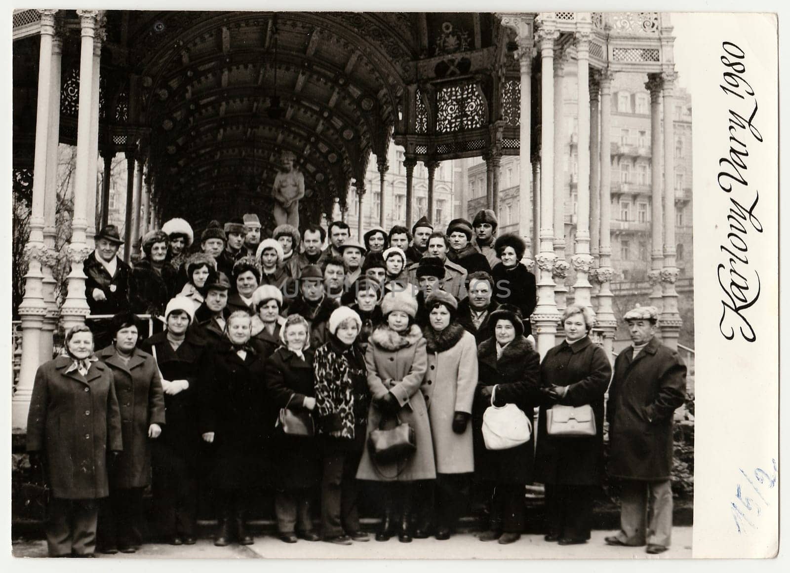 KARLOVY VARY, THE CZECHOSLOVAK SOCIALIST REPUBLIC - FEBRUARY 15, 1980: Vintage photo shows group of people on vacation in spa resort Karlovy Vary.