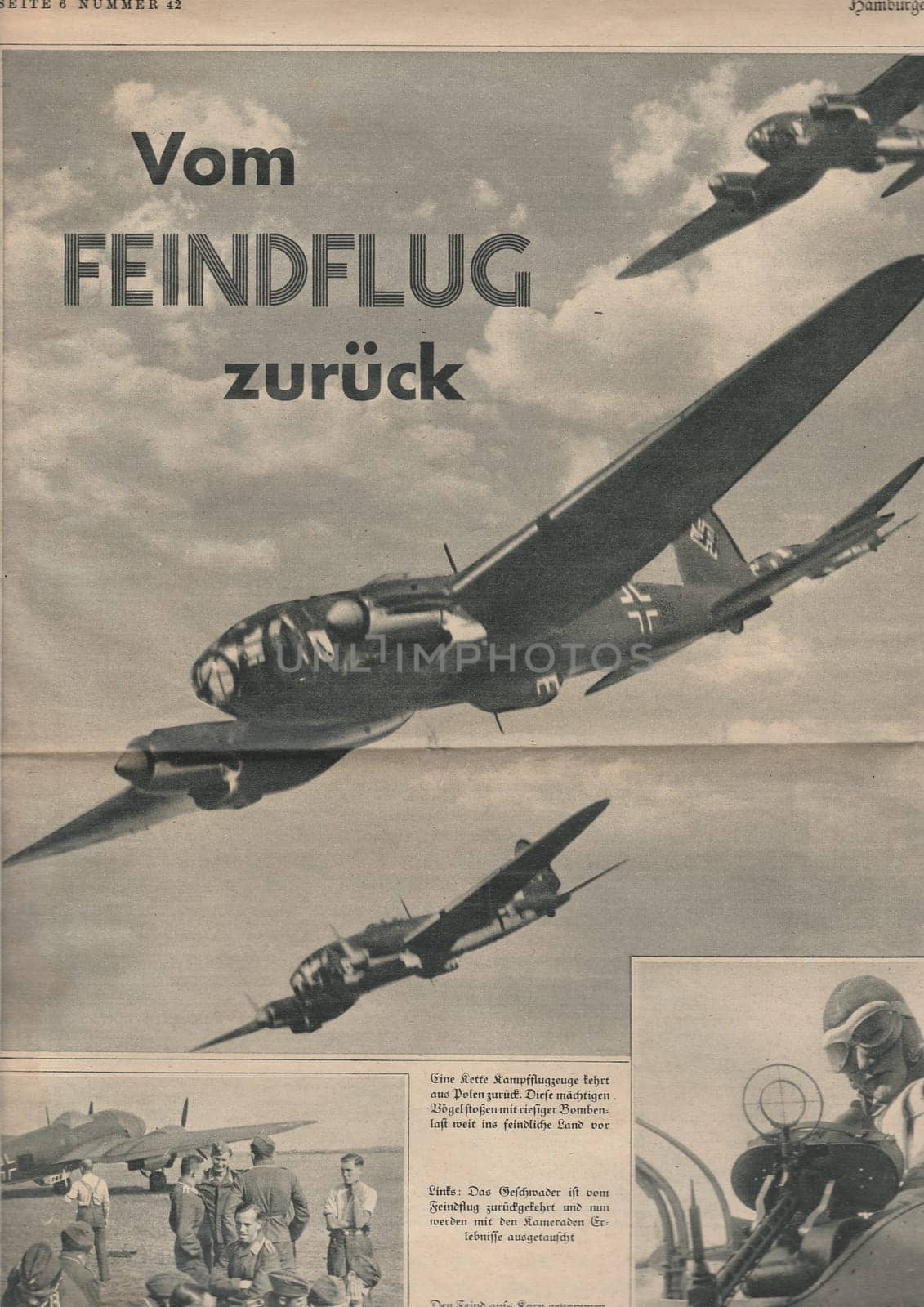 HAMBURG, GERMANY - 1939: Reproduction of magazine page shows pictures from Nazi Germany. Pilots and airplanes of Luftwaffe.
