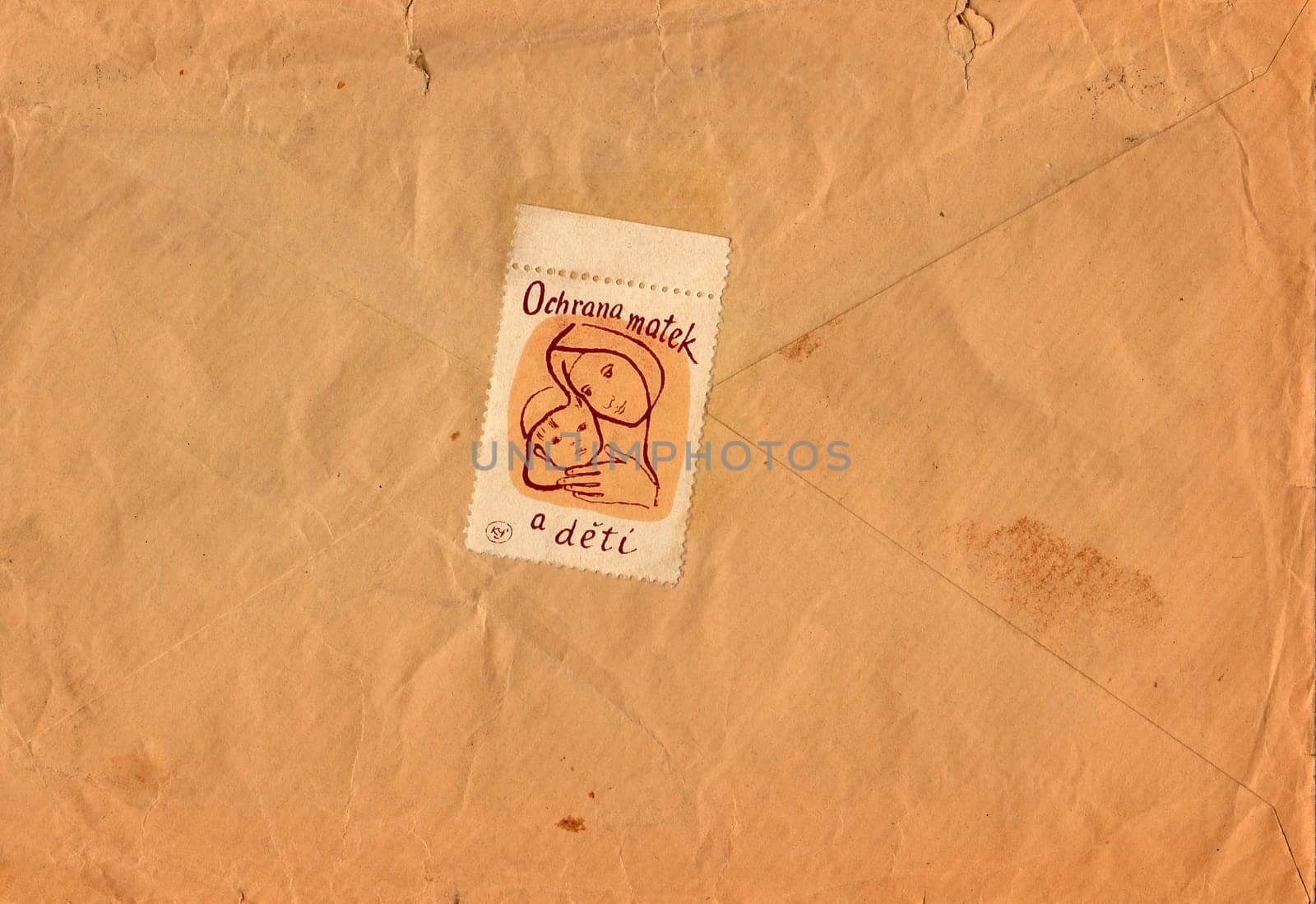 Back of an old used envelope. Rich stain and paper details. Can be used as background. by roman_nerud