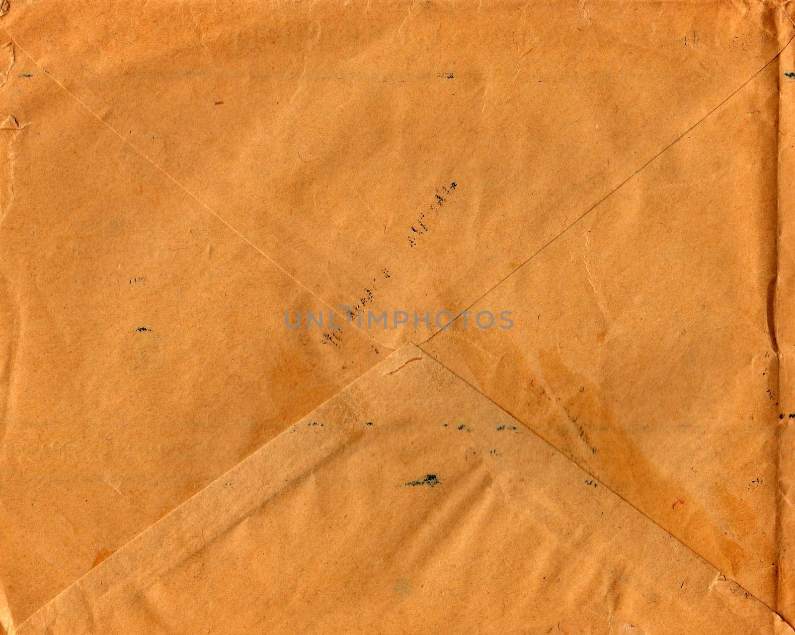 Back of an old used envelope. Rich stain and paper details. Can be used as background. by roman_nerud