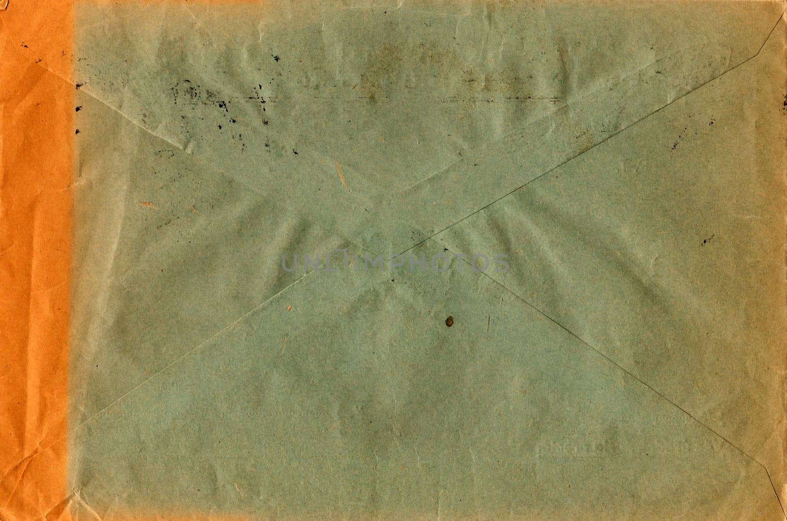 Back of an old used envelope. Rich stain and paper details. Can be used as background. by roman_nerud