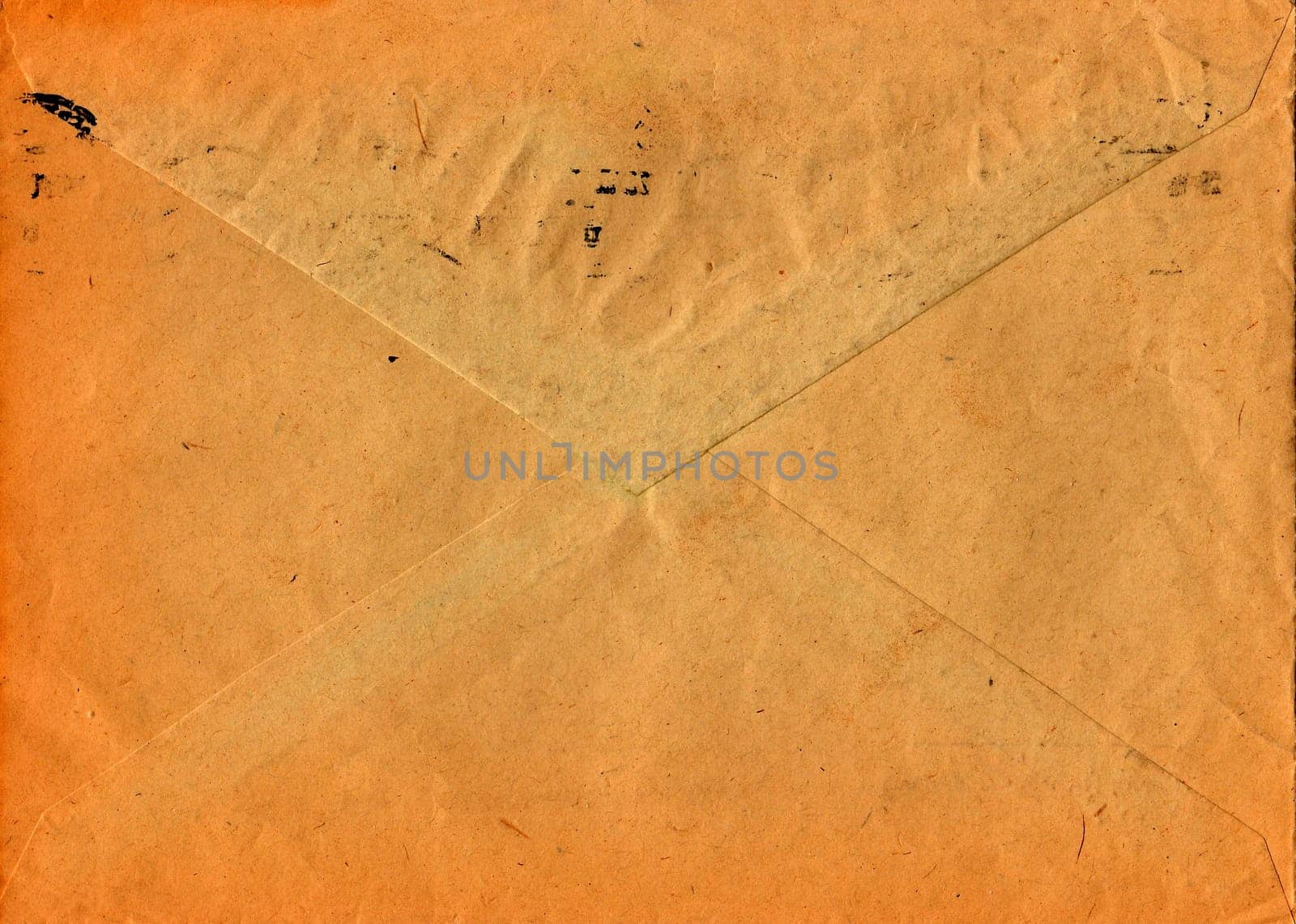 Back of an old used envelope. Rich stain and paper details. Can be used as background.