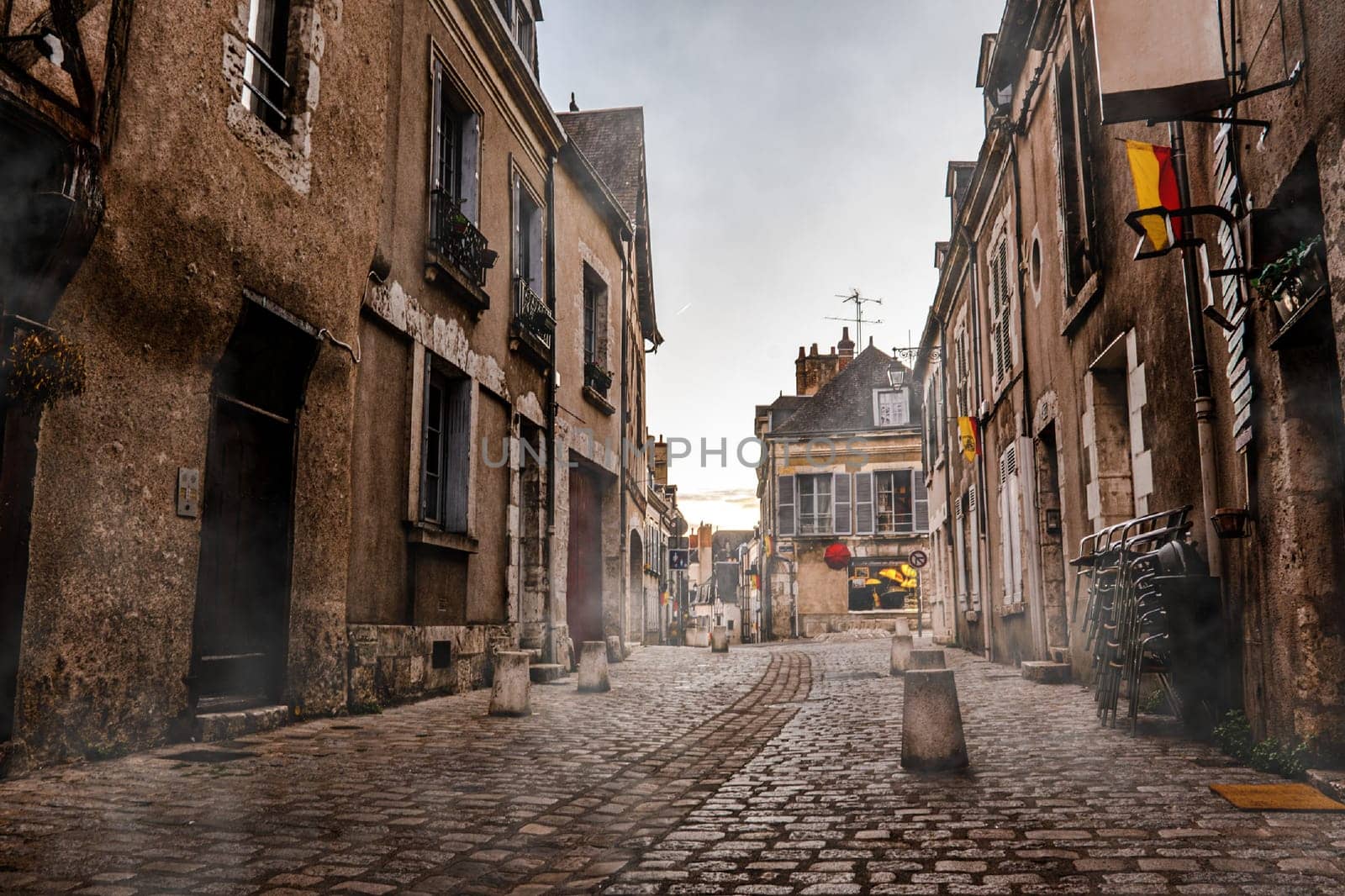 Central street in Blois, France. Beautiful morning city with mist,