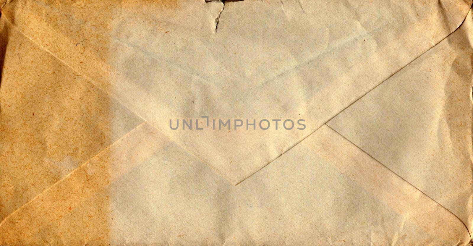 Back of an old used envelope. Rich stain and paper details. Can be used as background. by roman_nerud