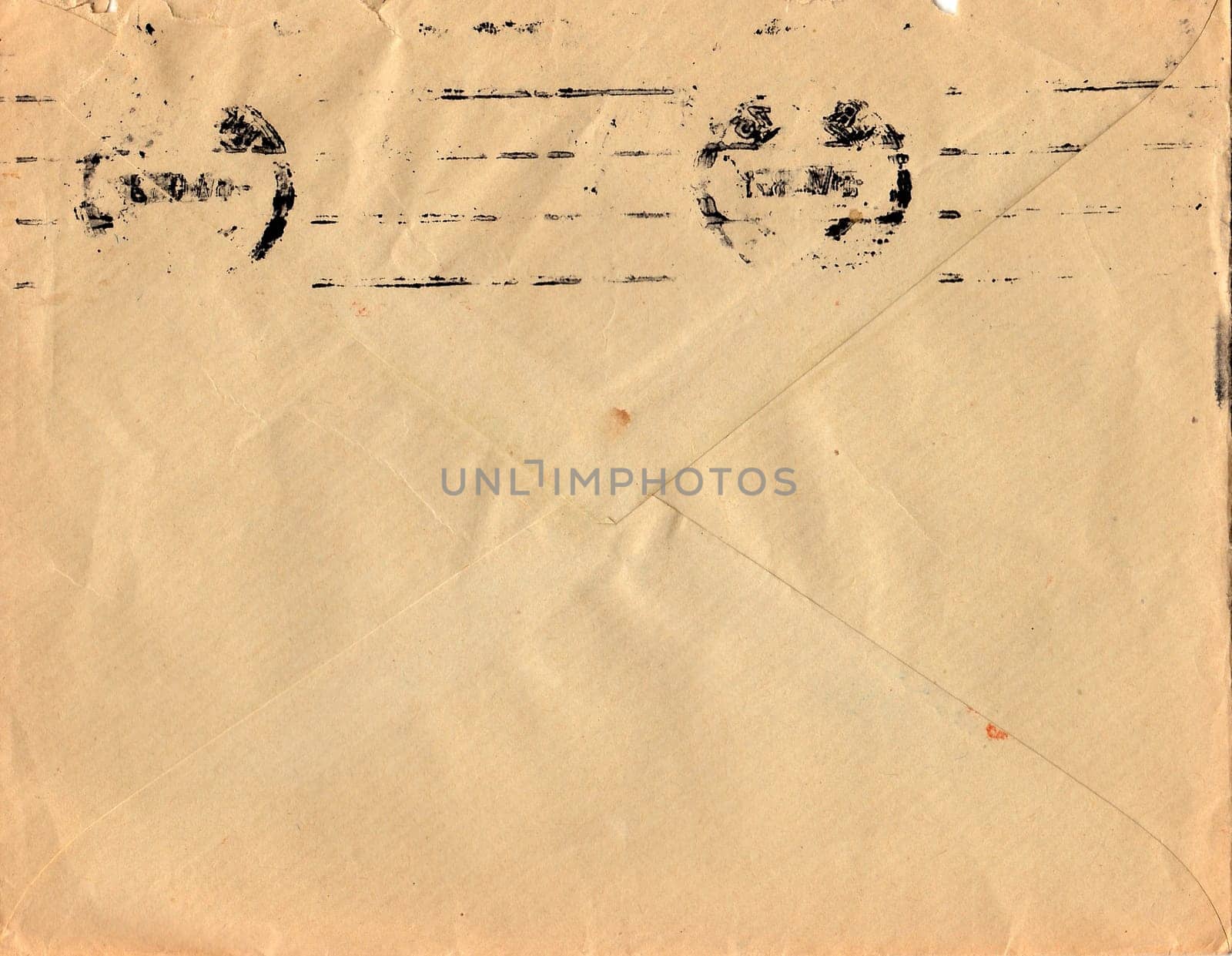 Back of an old used envelope. Rich stain and paper details. Can be used as background. by roman_nerud