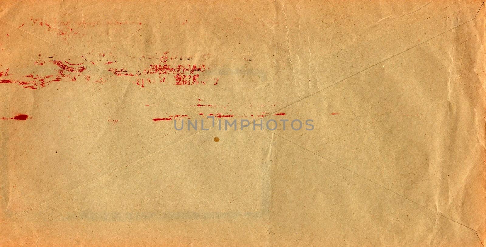 Back of an old used envelope. Rich stain and paper details. Can be used as background.