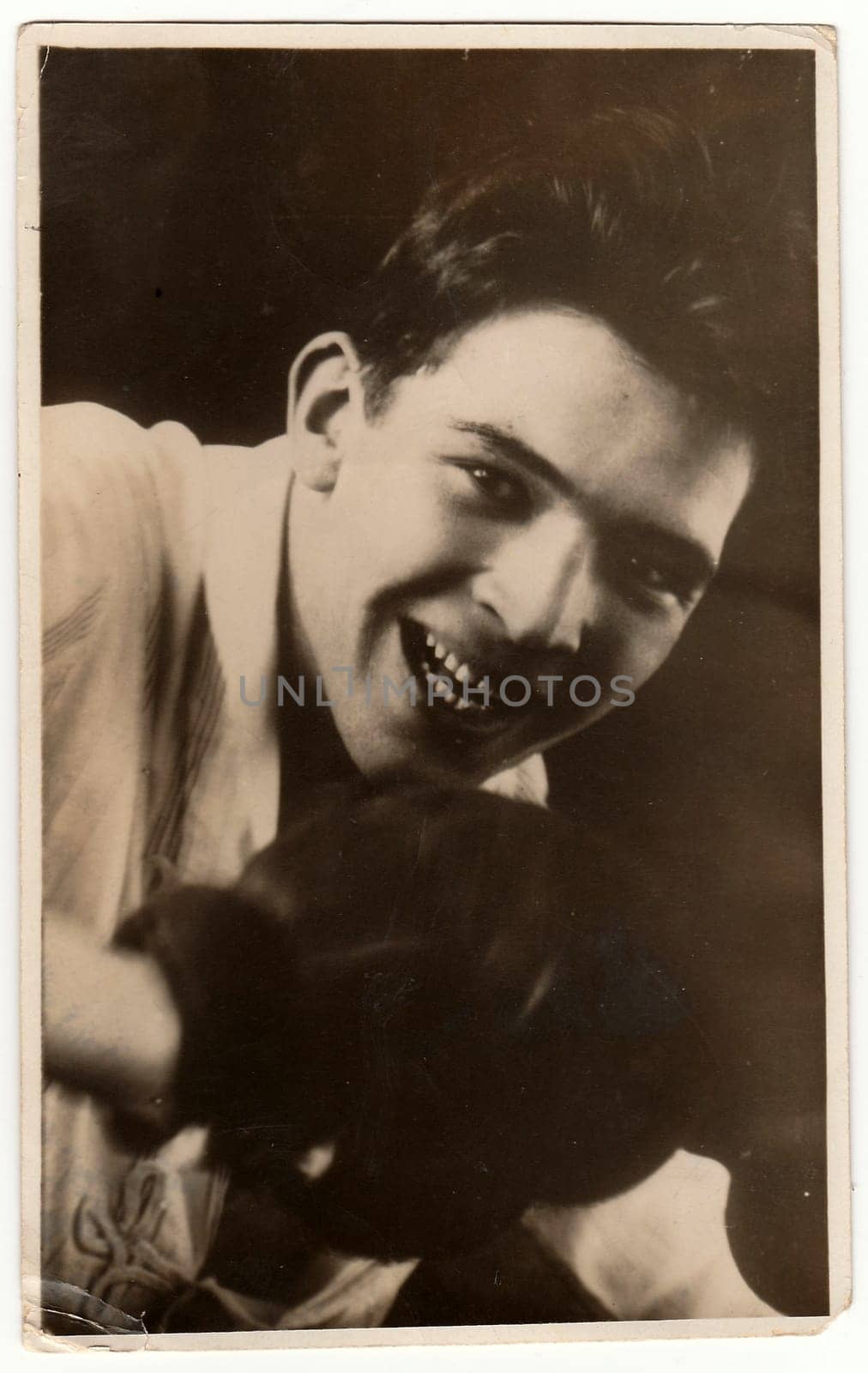 MONTEVIDEO, URUGUAY - 1925: Vintage photo shows young boxer poses to a box match. Antique black & white photo.