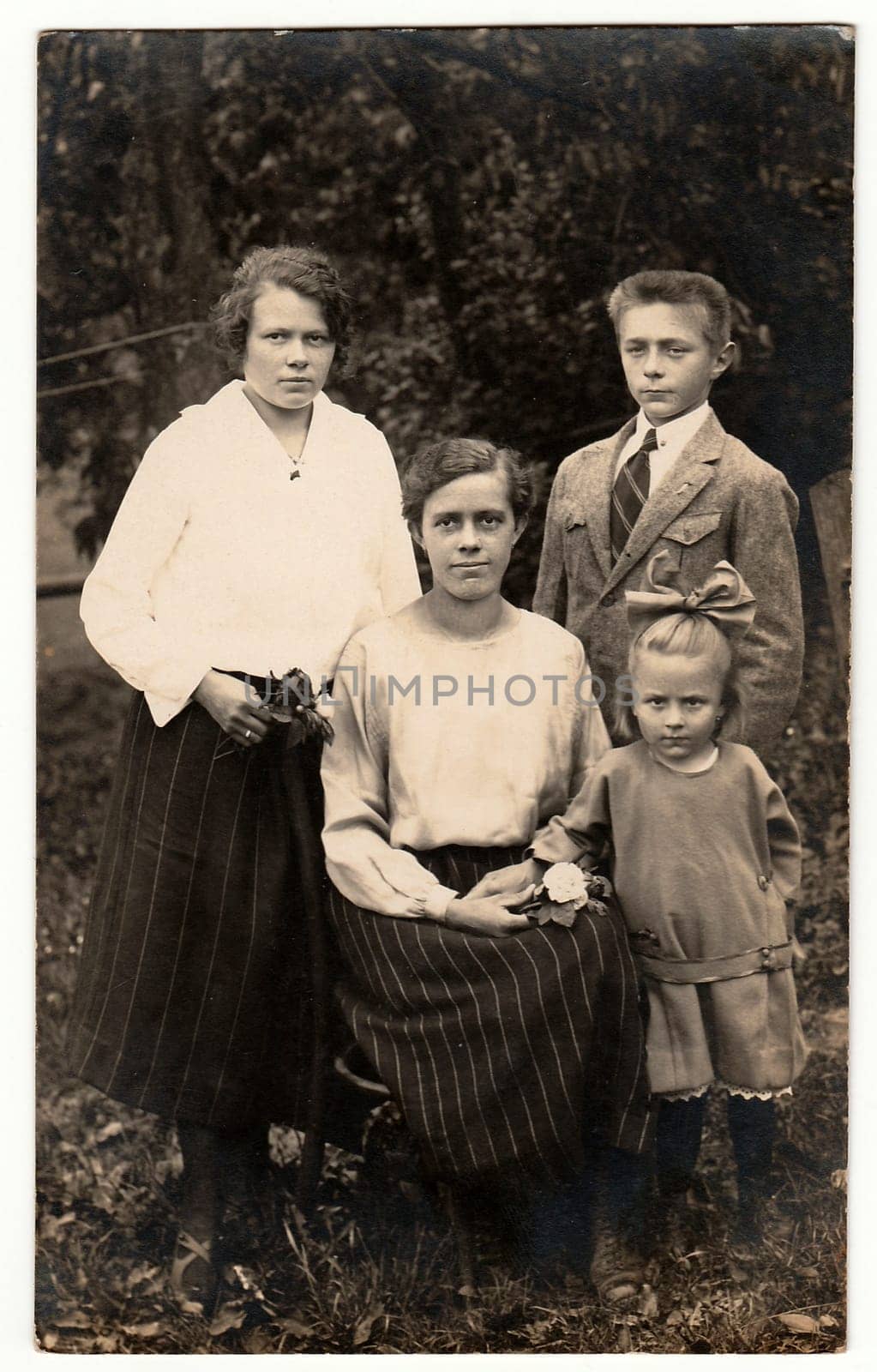 THE CZECHOSLOVAK REPUBLIC - CIRCA 1930s: Vintage photo shows women with children outdoors. Antique black & white photo.