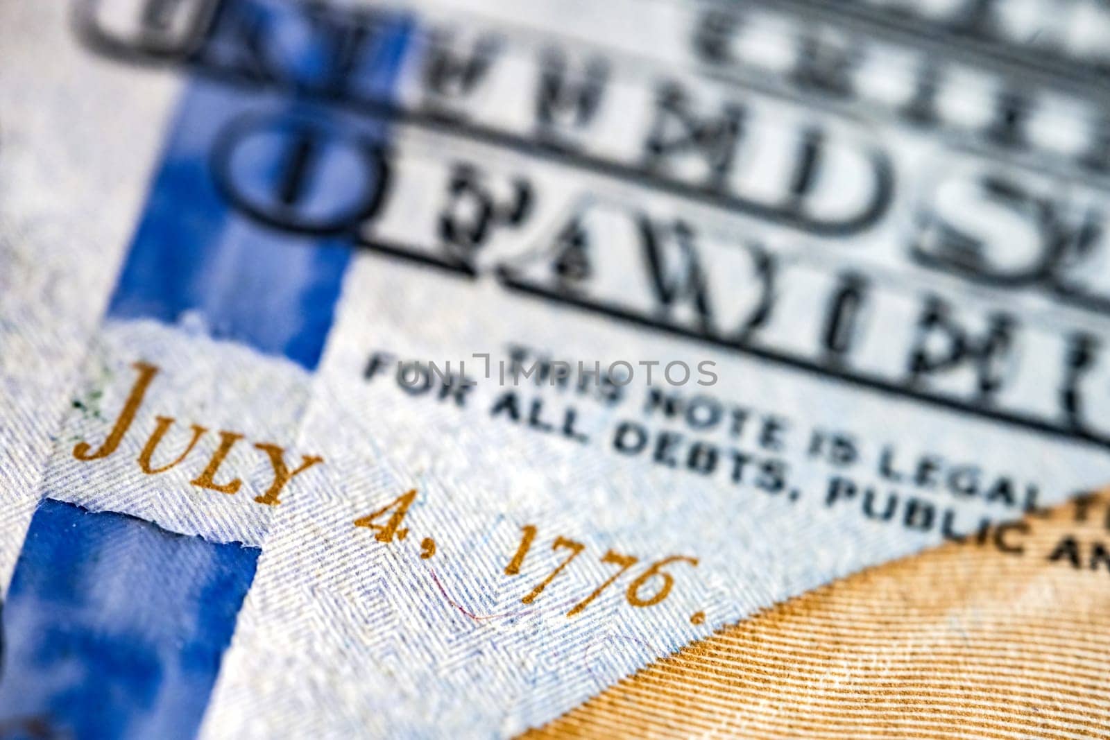 Close up macro view of one hundred American dollars bill. 4 July 1776 fragment. United States currency.