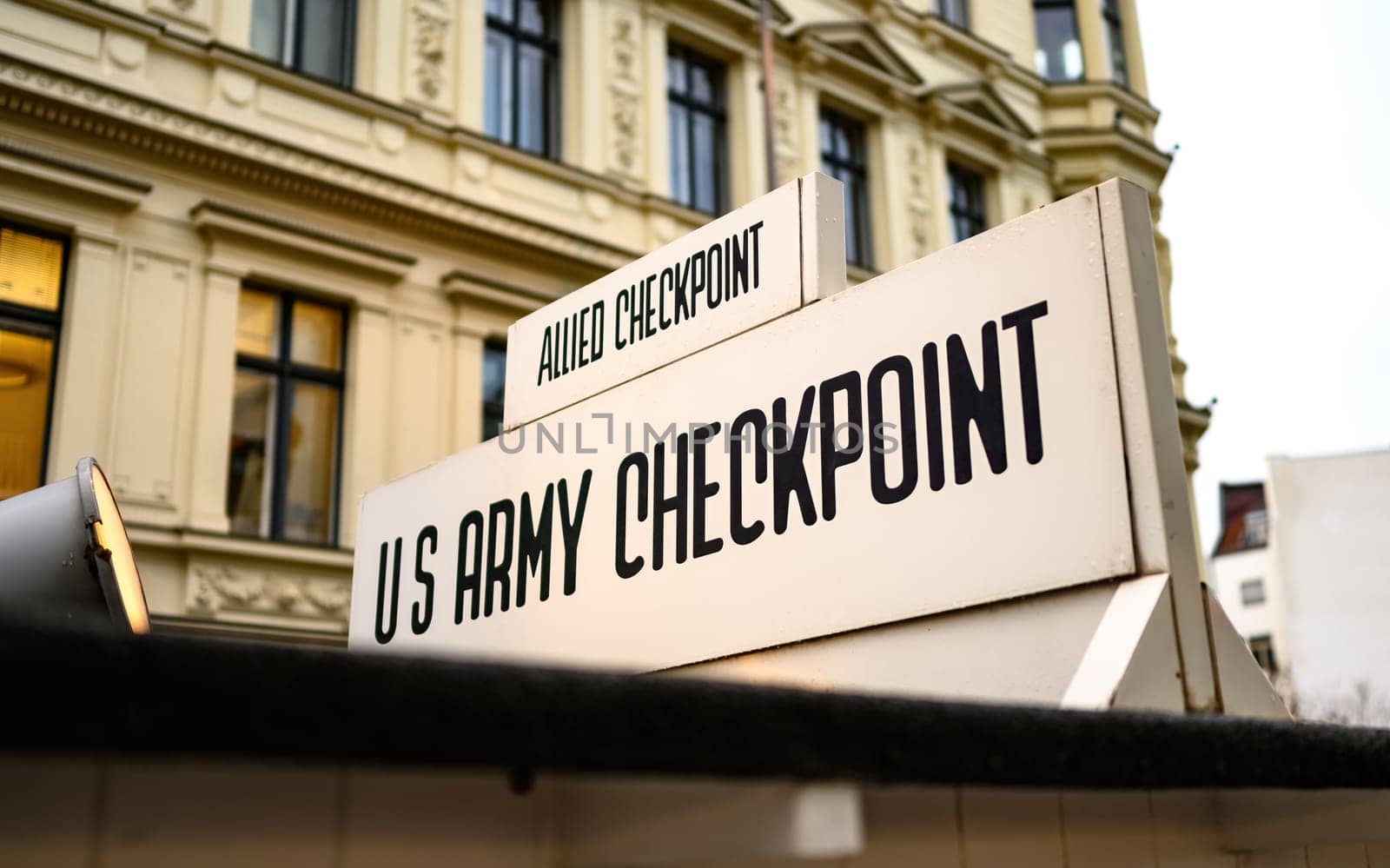 Signpost at Checkpoint Charlie. The crossing point between East and west Berlin, symbol of the Cold War.