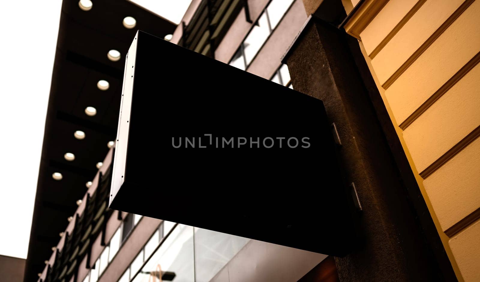 Black billboard in the city street for your text, logo or design. Board mock up.