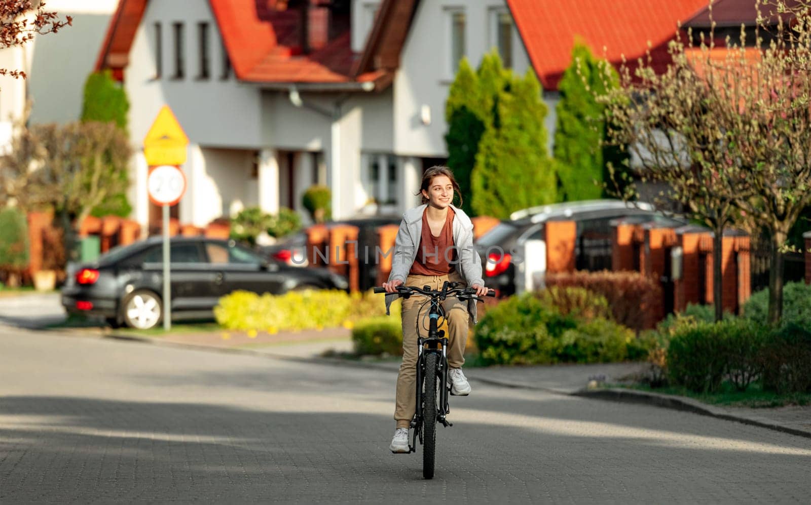 Cute girl with a bike on the road by GekaSkr