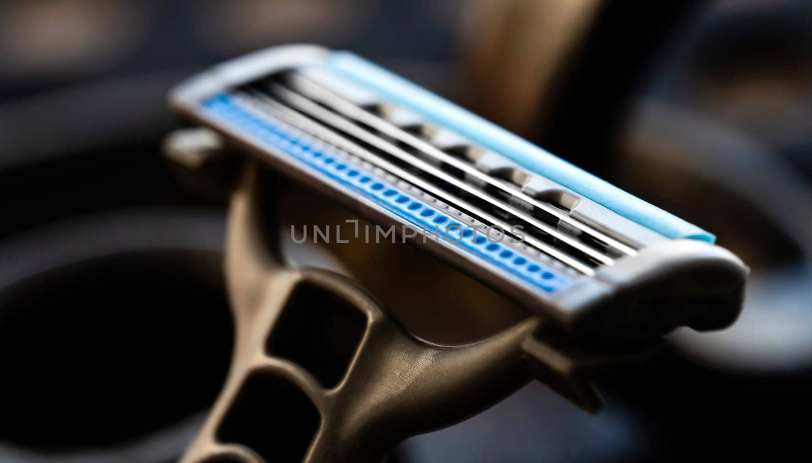 Brand new shaving razor for man beard hygiene closeup. Daily care shaver with sharp metal blades macro