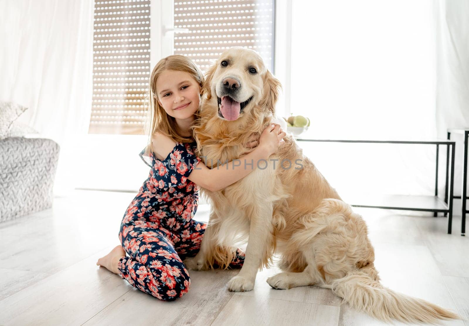 Cute little girl playing with beautiful goden retriever dog by GekaSkr