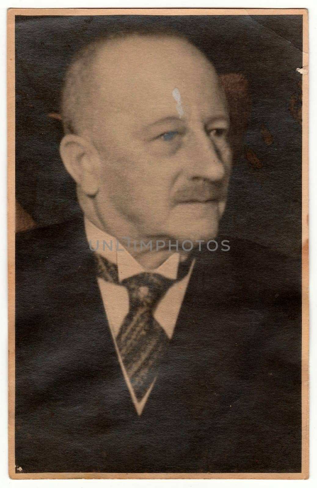 LIBEREC (REICHENBERG), THE CZECHOSLOVAK REPUBLIC - CIRCA 1920s: Vintage photo shows an old man. Black white antique studio portrait.