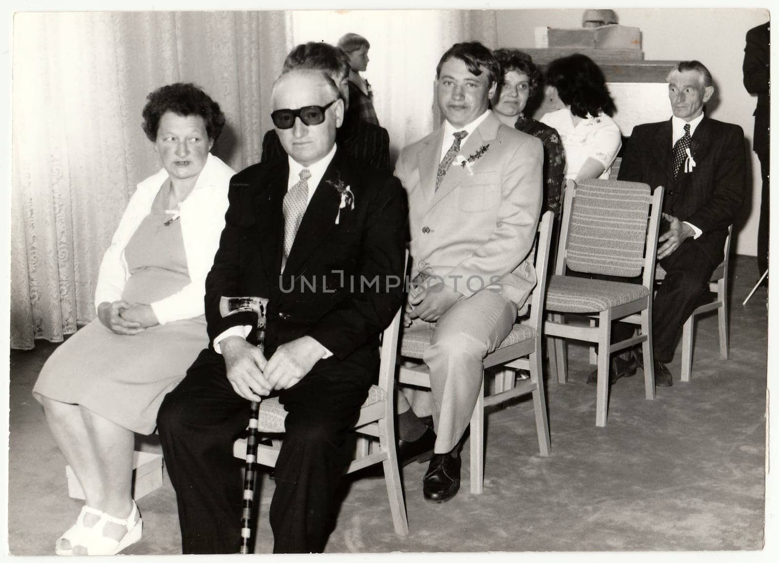 THE CZECHOSLOVAK SOCIALIST REPUBLIC - CIRCA 1980: Vintage photo shows wedding guests during wedding ceremony. Black white antique photo.