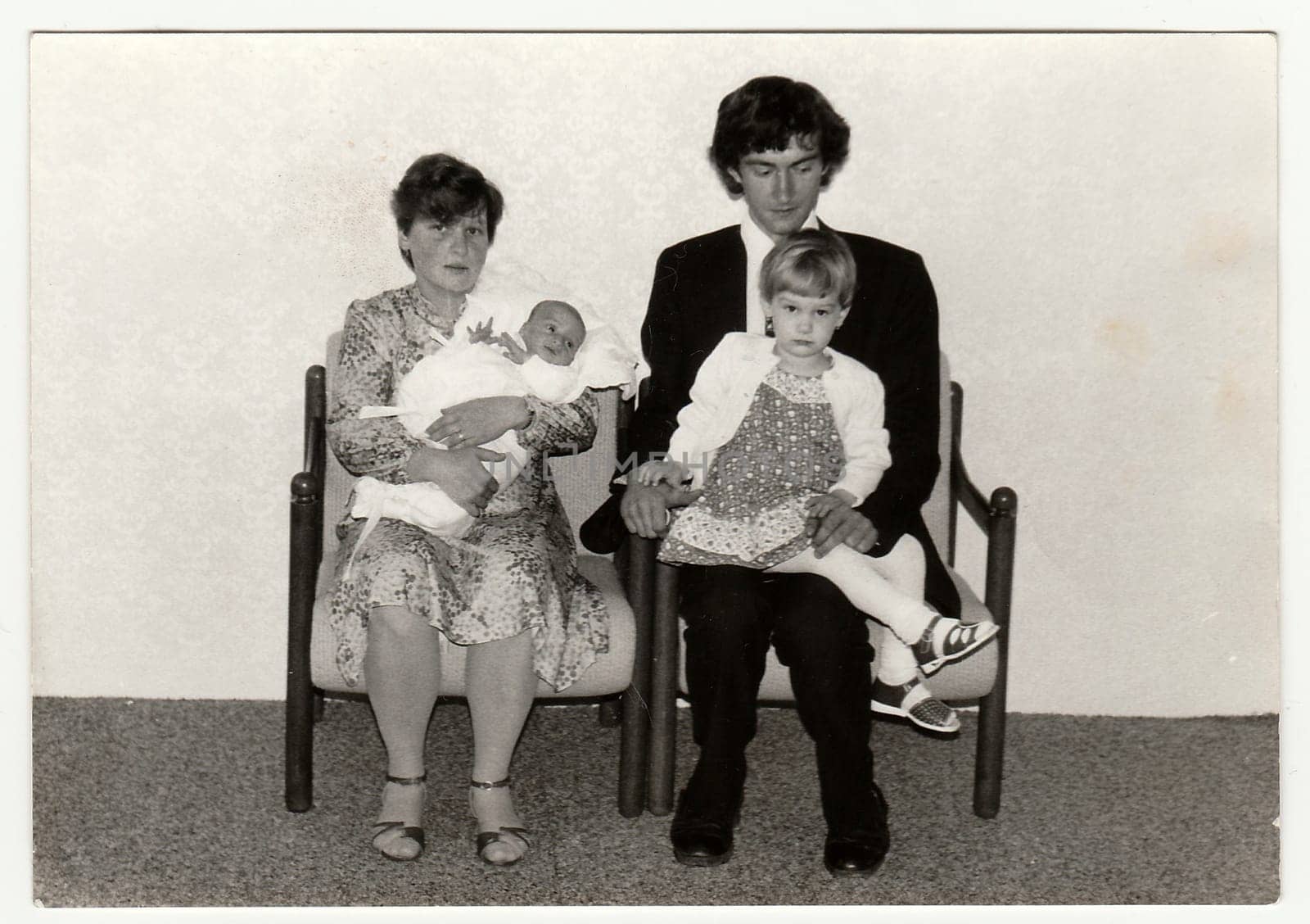 Vintage photo shows parents with their children. Antique black white photo. by roman_nerud