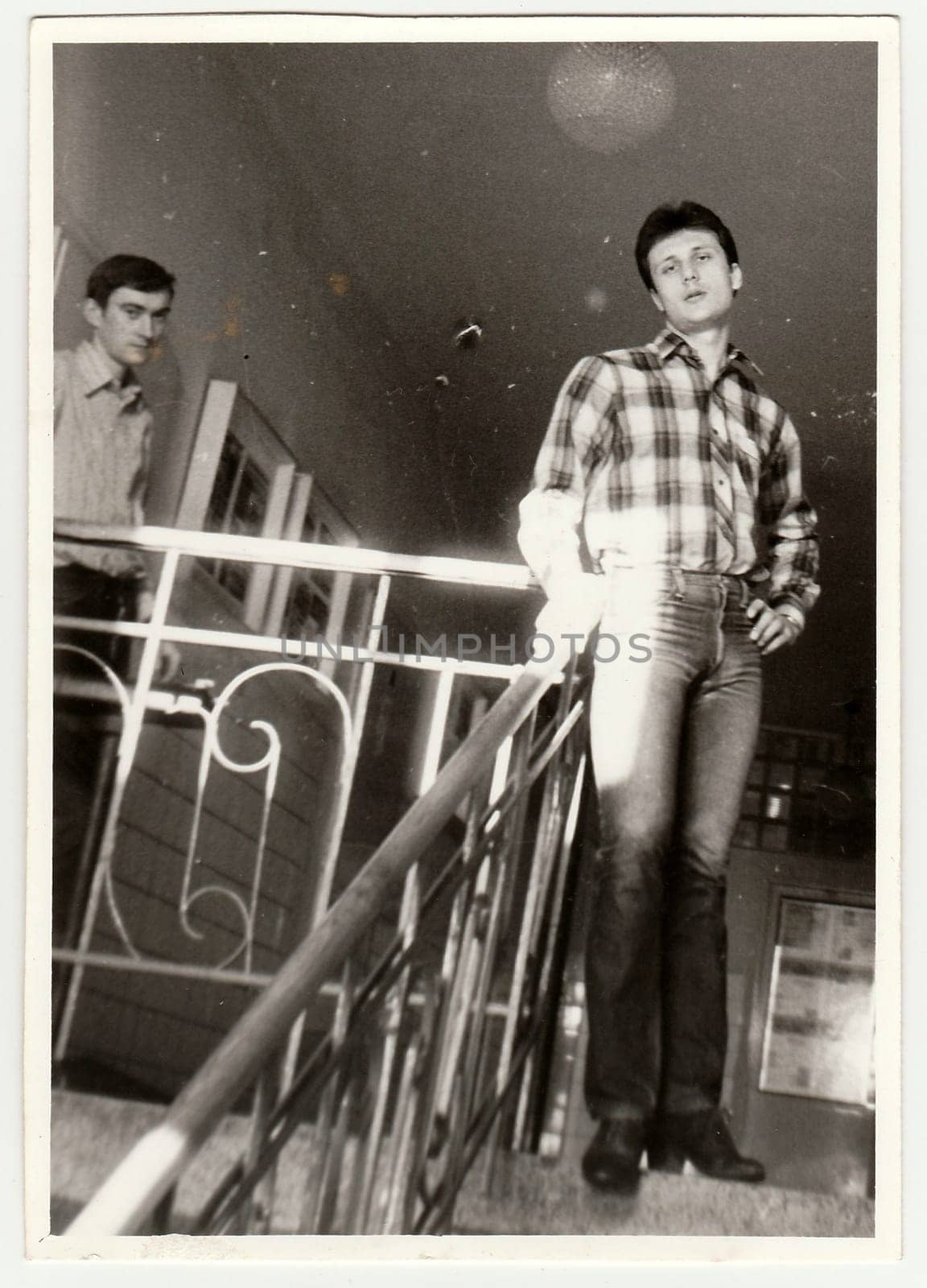 Vintage photo shows boys in the hall of residence (dormitory). Antique black & white photo. by roman_nerud