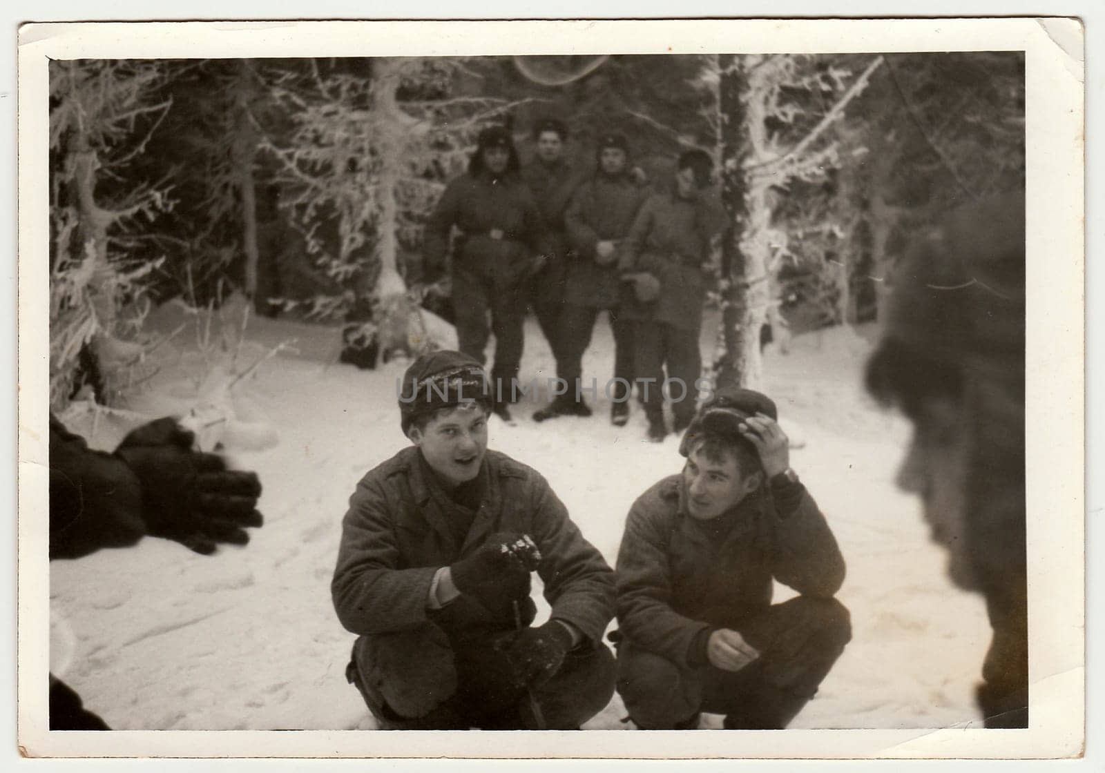 THE CZECHOSLOVAK SOCIALIST REPUBLIC - CIRCA 1970s: Vintage photo shows soldiers pose outdoors in winter time. Black & white antique photo.