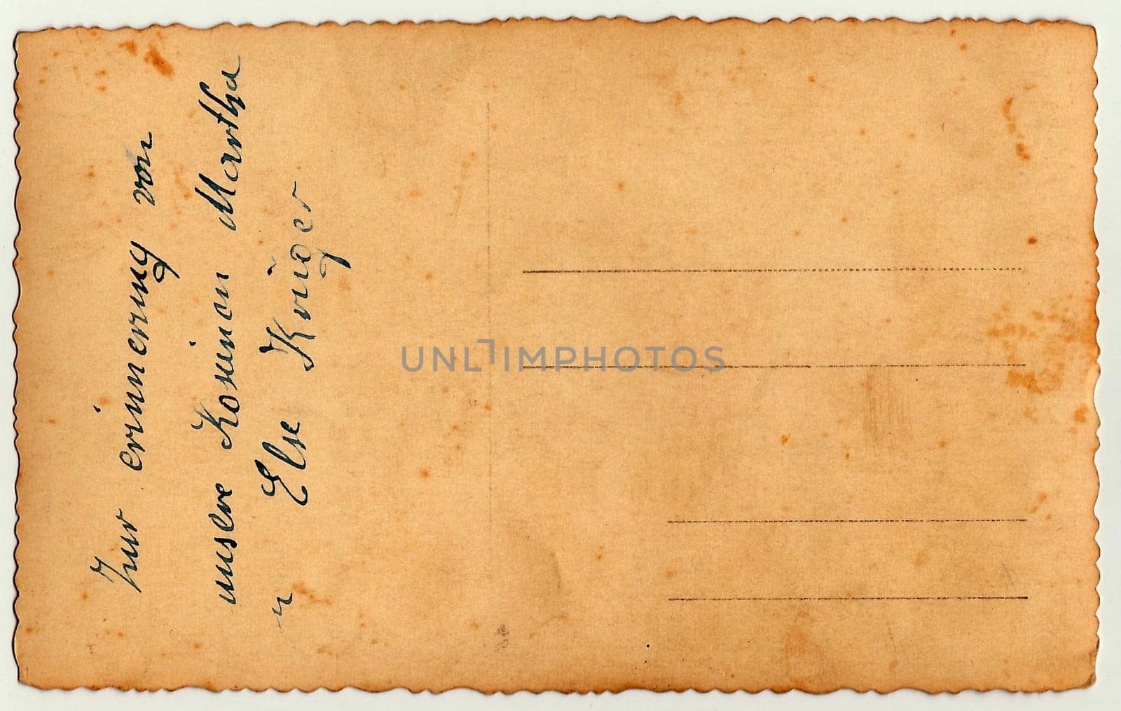 Back of a vintage photo - postcard. Rich stain and paper details. Can be used as background. Image contains handwriting.