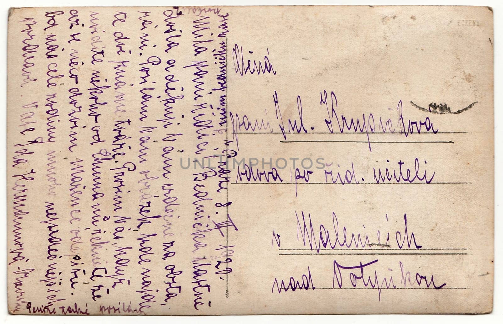 THE CZECHOSLOVAK REPUBLIC - MARCH 8, 1920: Back of a vintage photo - used postcard. Rich stain and paper details. Can be used as background. Image contains handwriting.