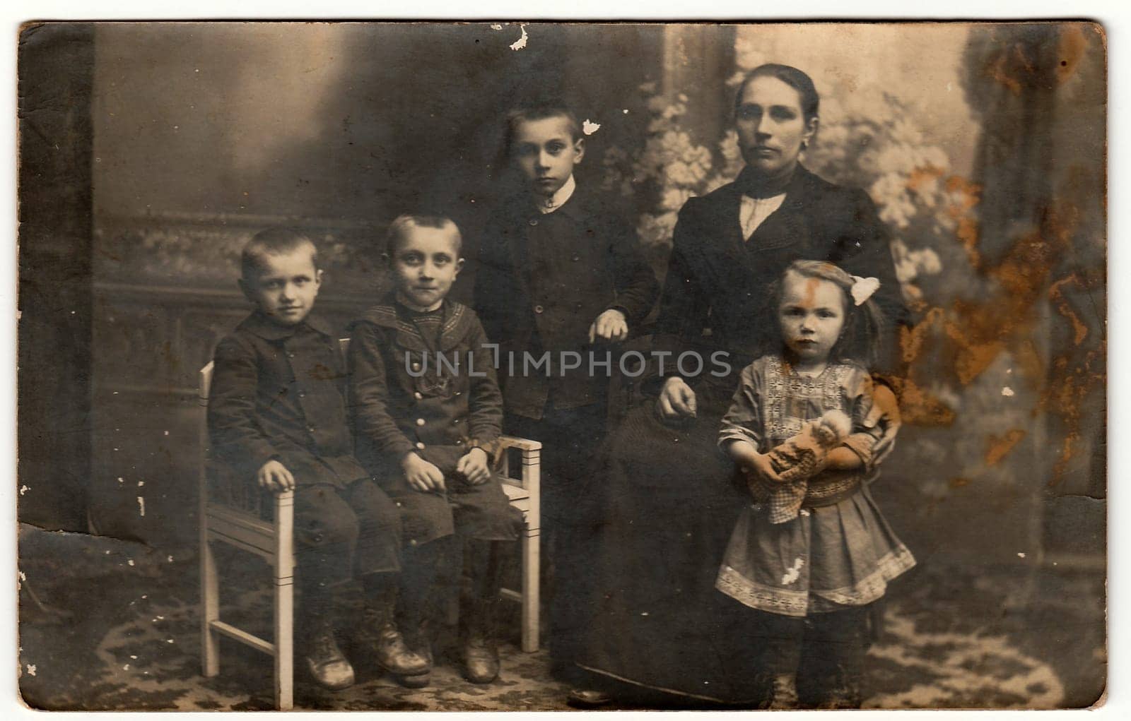 Vintage photo shows mother with children. Black white antique photography. by roman_nerud