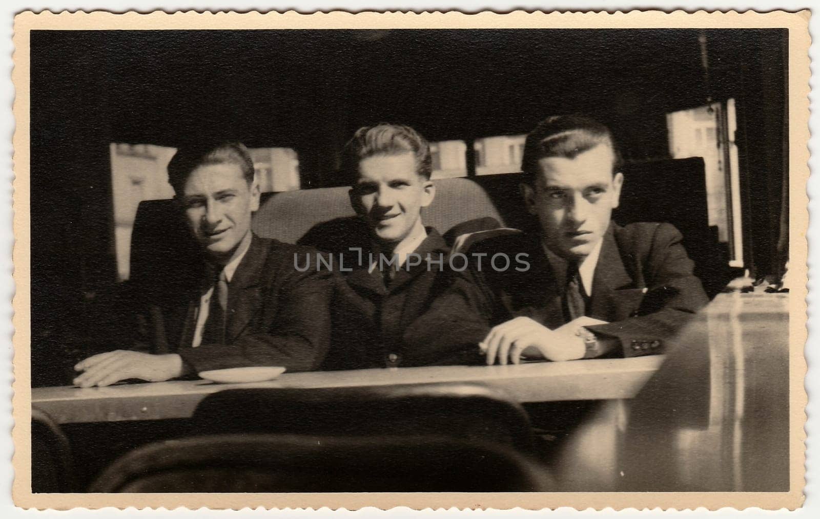 Vintage photo shows men sit at a coffee bar. Black white antique photography. by roman_nerud