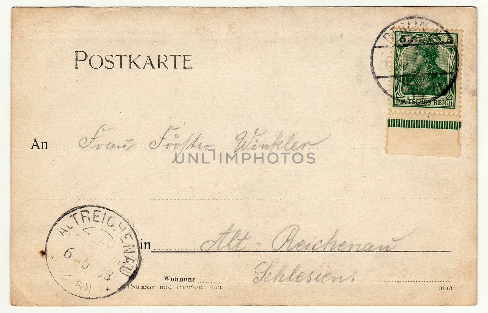 BERLIN, GERMANY - CIRCA 1930s: Back of a vintage photo - used postcard. Rich stain and paper details. Can be used as background. Image contains handwriting.