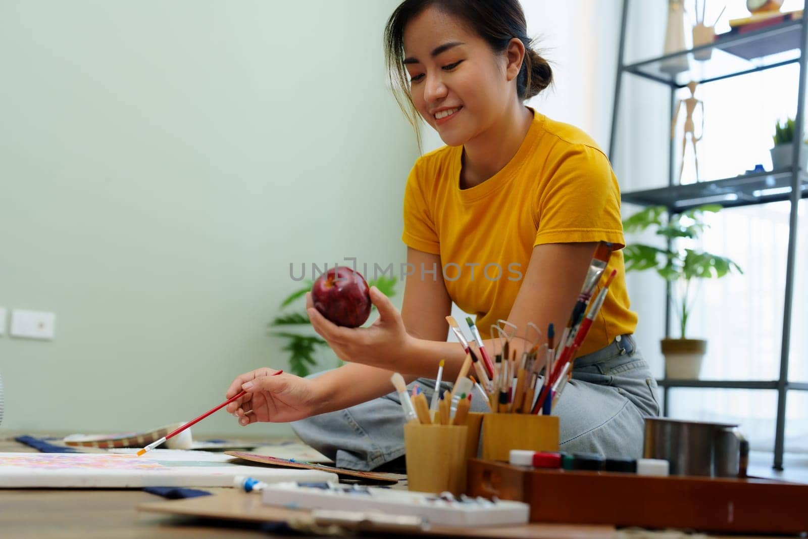 Portrait of an Asian woman designing art in her spare time. by Manastrong