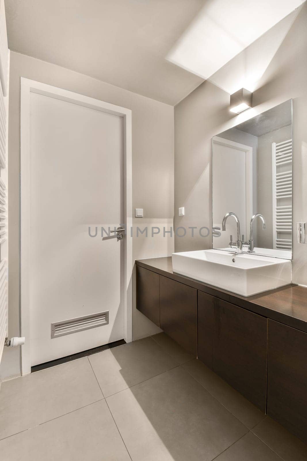 a bathroom with a sink and mirror and a shower by casamedia