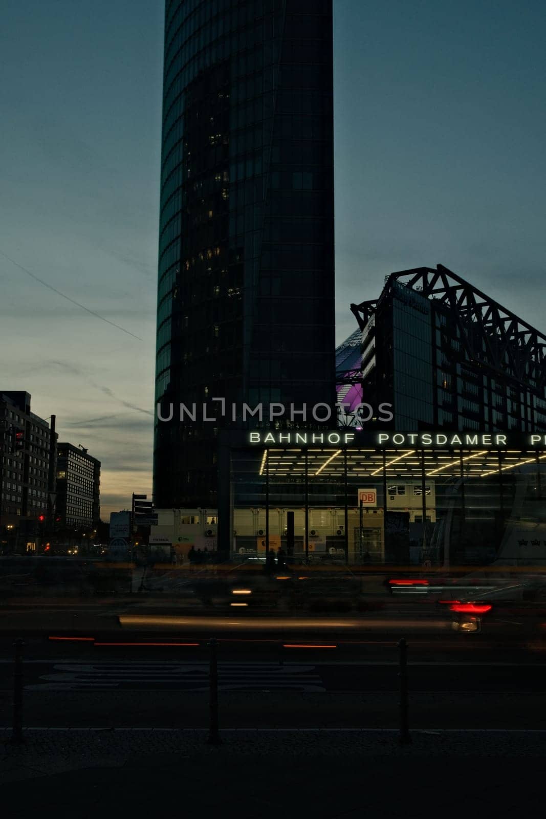 Vertical shot of a skyscraper at Potsdamer Platz at night