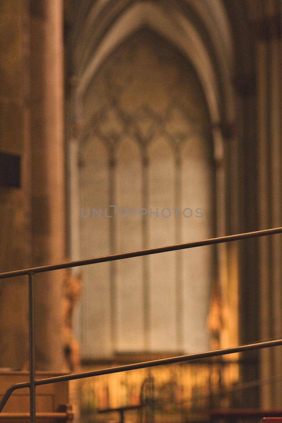 Vertical shot of details of pews and railings in Cologne Cathedral in Cologne, Germany
