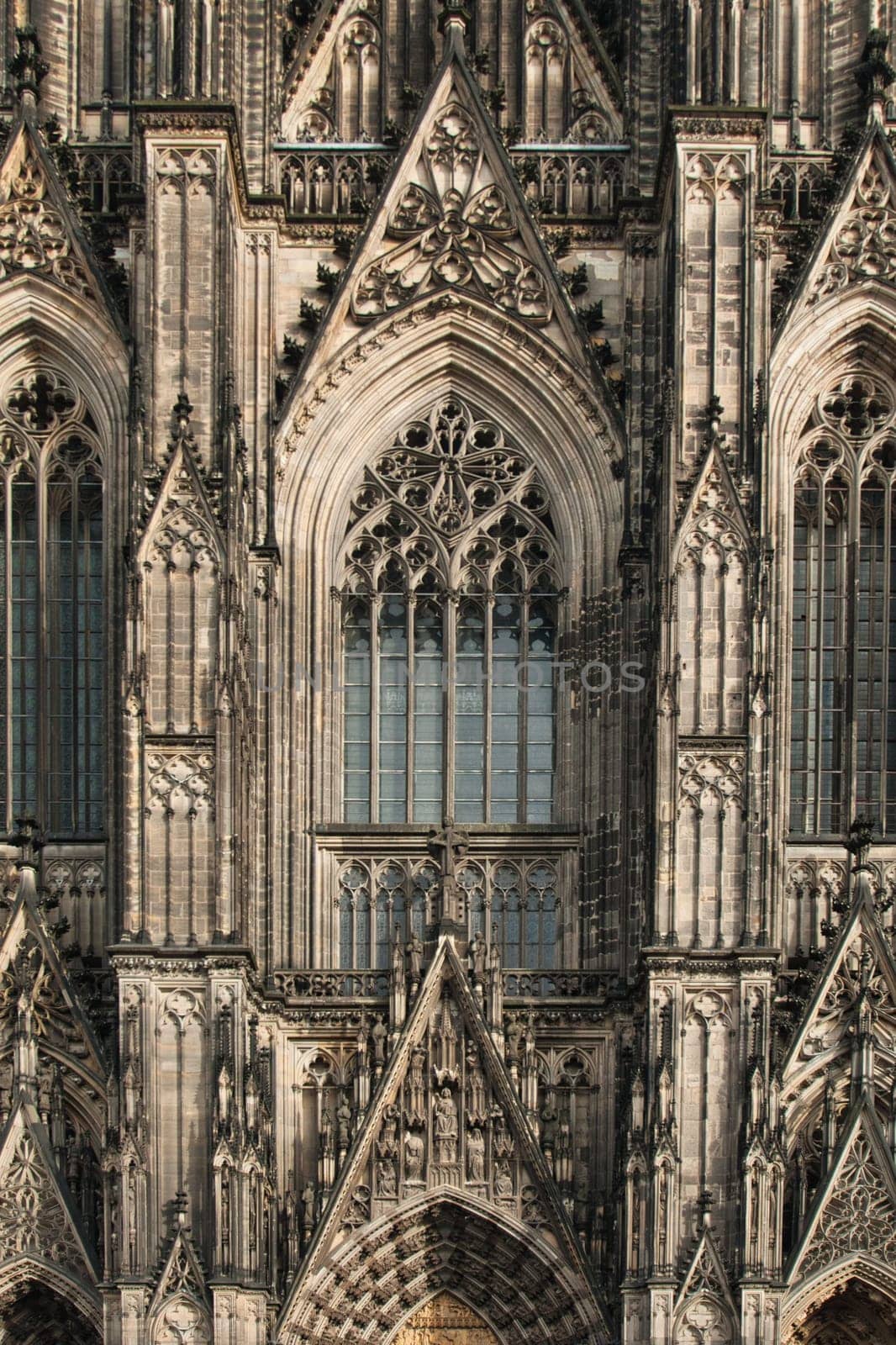 Vertical shot of the facade of the Cologne Cathedral with decoration and ornaments, Cologne, Germany