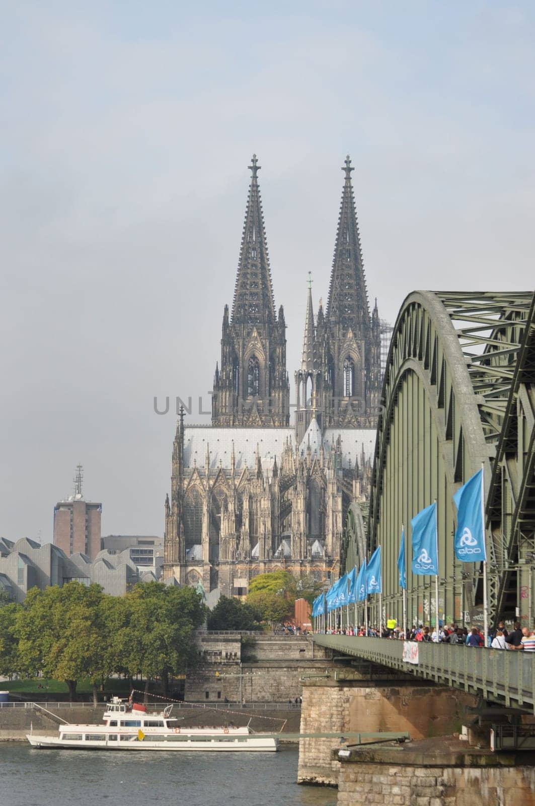 Vertical shot of the Hohenzollern Bridge and the Cologne Cathedral in Cologne, Germany