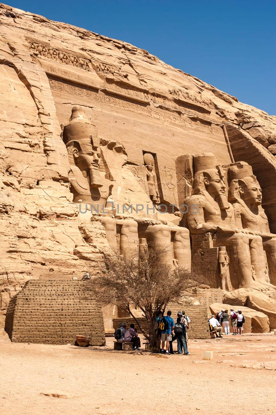 Abu Simbel, Aswan, Egypt - April 18 2008: Tourists visiting the archaeological site of Abu Simbel, Aswan, Egypt