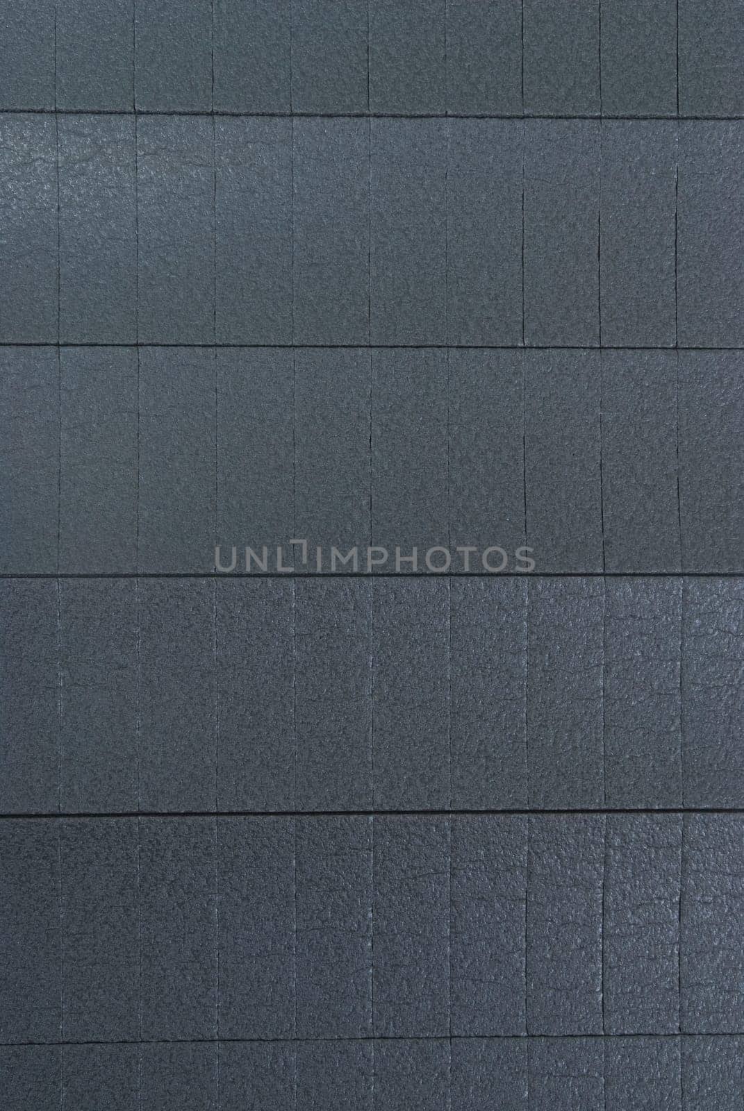 Roll of gray foam rubber sheet isolated in white by emirkoo