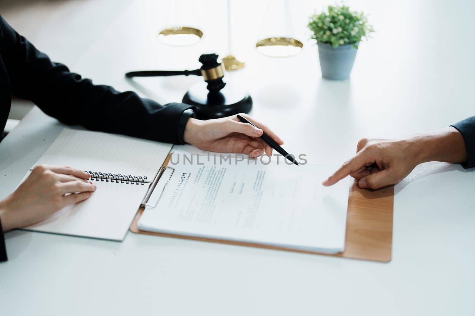 The signing of important documents between the lawyer and the client to enter into an agreement in a court case.