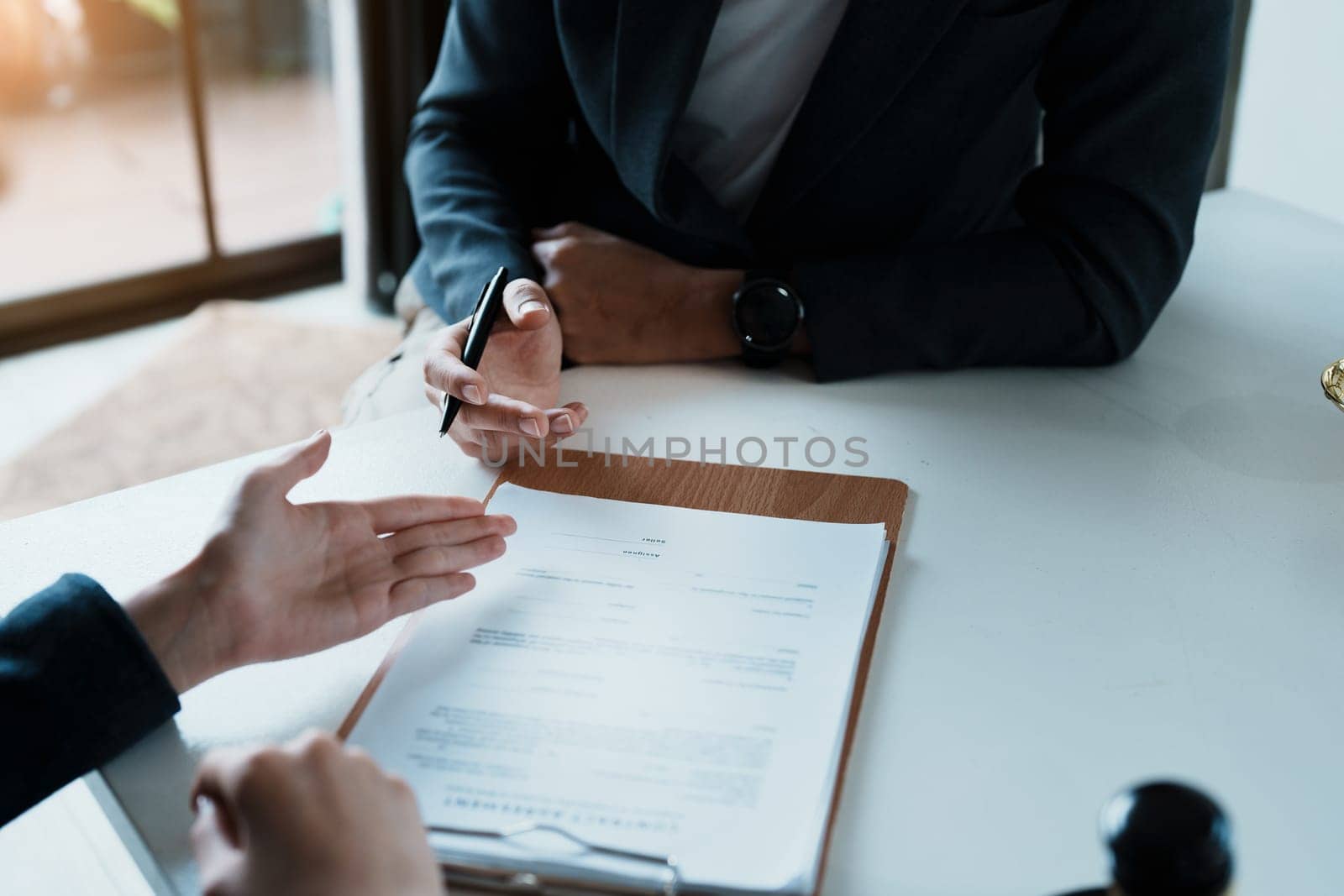 The signing of important documents between the lawyer and the client to enter into an agreement in a court case.