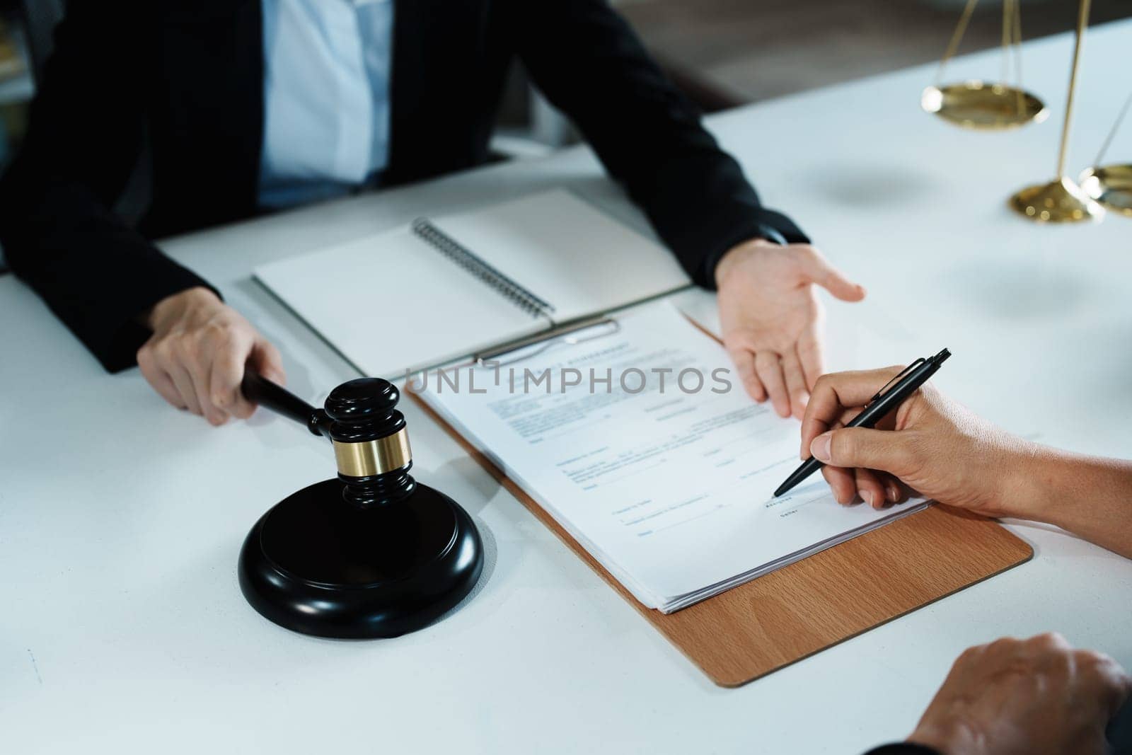 The signing of important documents between the lawyer and the client to enter into an agreement in a court case.